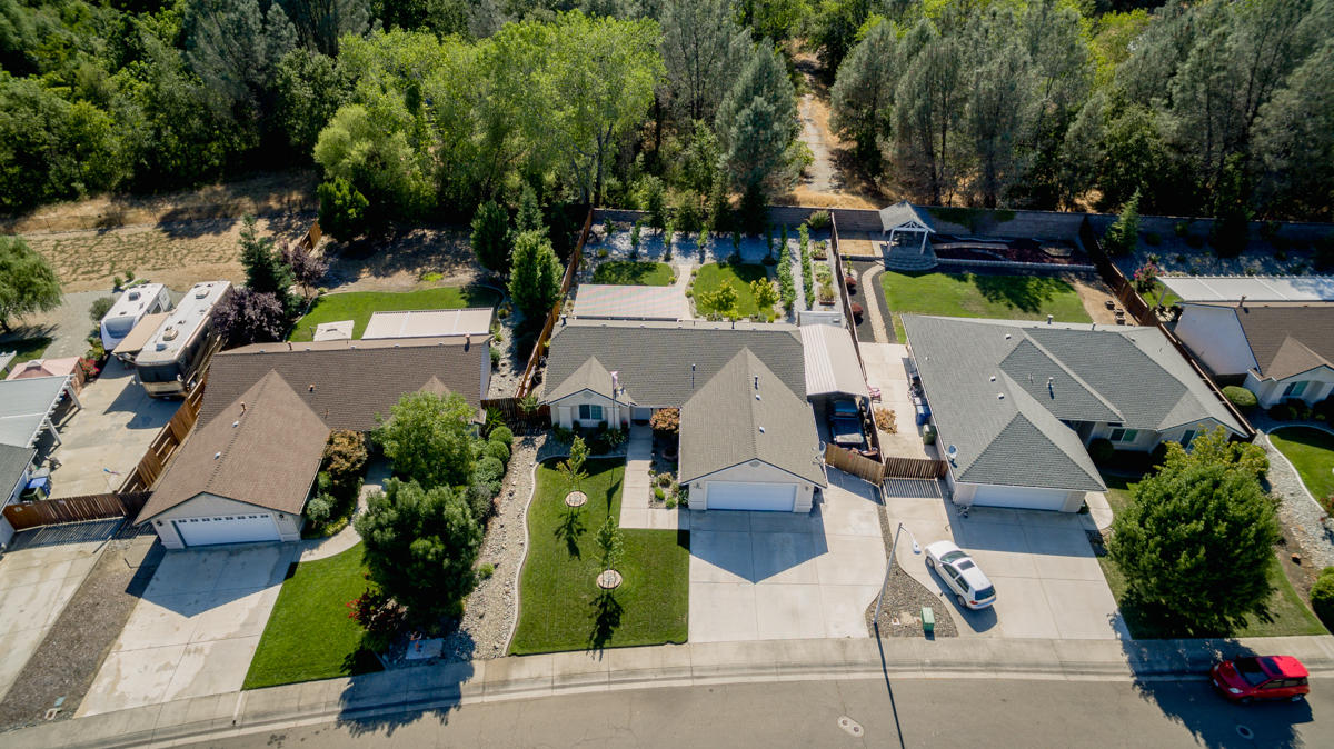 7502 Pit Road Redding, CA 96001 - Photo 23 of 26 an aerial view of a house with garden space and street view