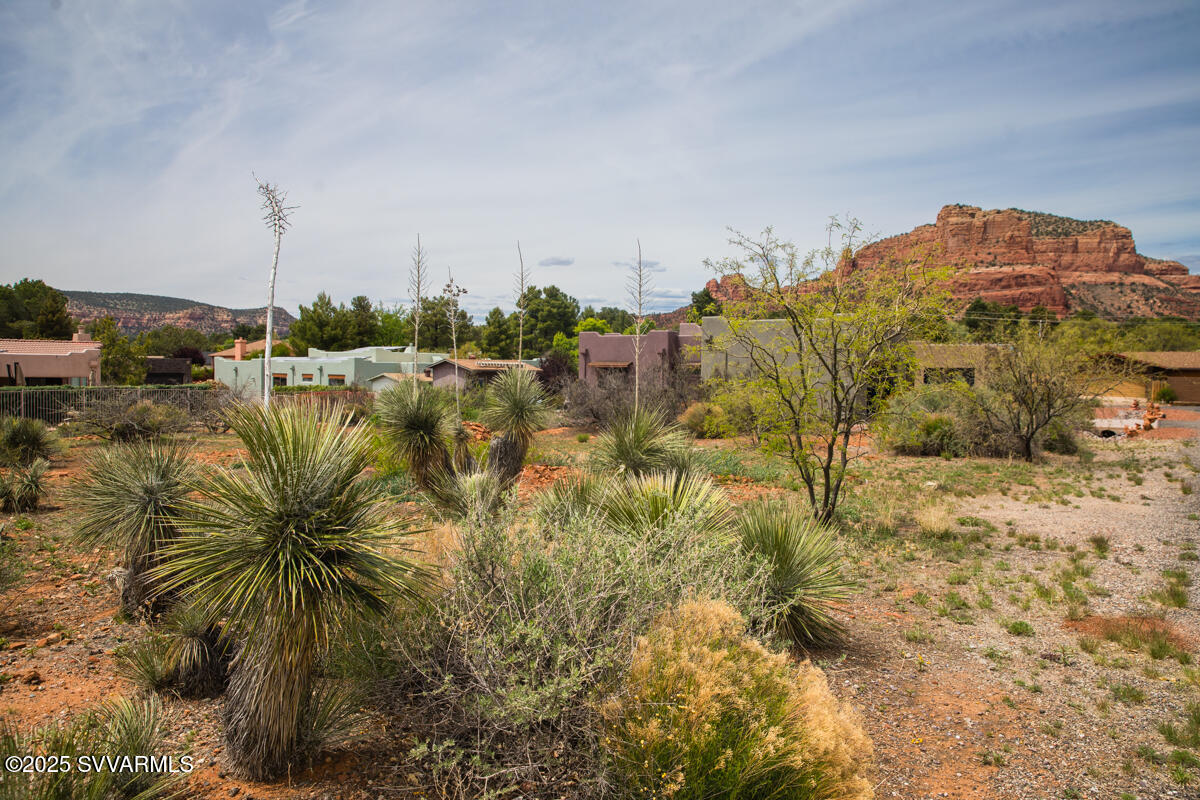 26 South House Rock Road, Unit 43 Sedona, AZ 86351 - Photo 5 of 15 a view of a lake with a building in the background