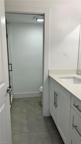 a view of bathroom with a sink and toilet