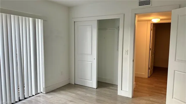 a view of a bathroom from a hallway