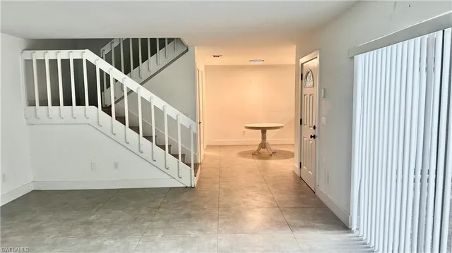 a view of a hallway with staircase