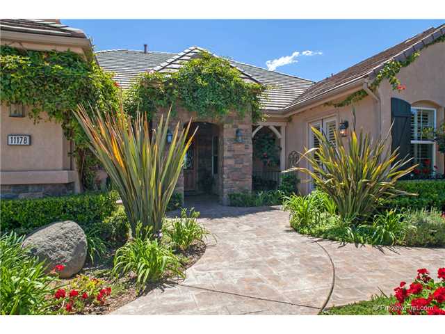 11178 Quail Canyon Road El Cajon, CA 92021 - Photo 1 of 25 LARGE COVERED ENTRY FEATURING A CUSTOM WOOD, IRON, AND GLASS EIGHT FOOT DOOR.