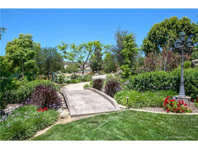 11178 Quail Canyon Road El Cajon, CA 92021 - Photo 22 of 25 BRIDGE THAT LEAD TO YOUR VEGTABLE GARDEN. NOTICE THE POST LAMP THAT ARE FEATURED THROUGH OUT THE YARD. GREAT HOME TO SEE AT NIGHT.
