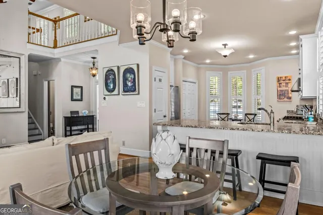 a large kitchen with a table and chairs