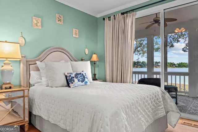 a bedroom with a bed next to a window with outer view