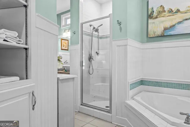 a bathroom with a tub and a shower