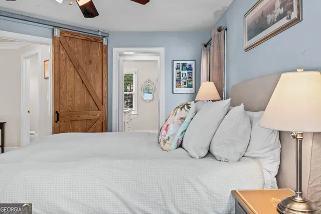 a bathroom with a granite countertop sink and a window