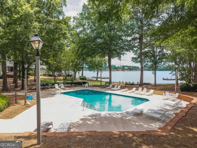 a backyard of a house with barbeque oven and outdoor seating