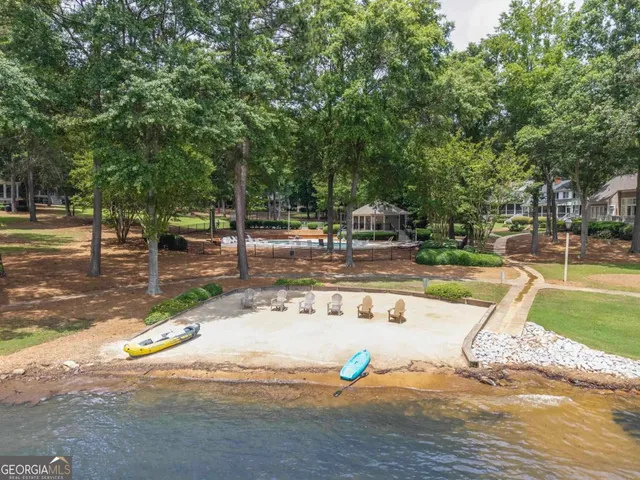 an aerial view of a houses with ocean view