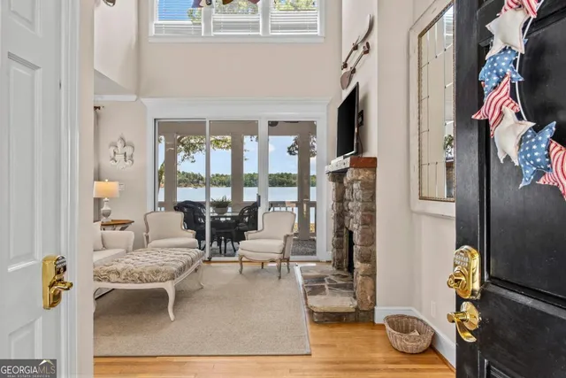 a living room with furniture and floor to ceiling window