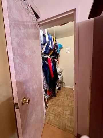 a bed room with a bed and a chair