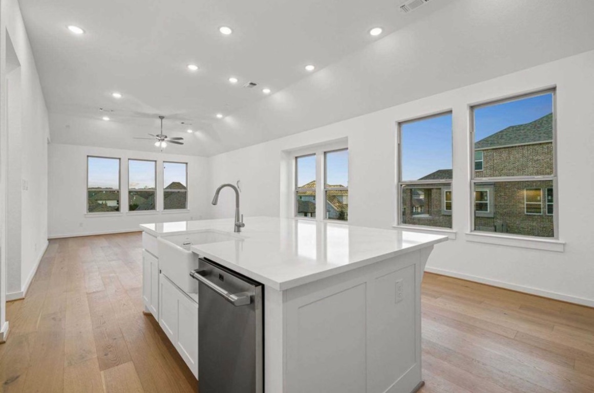 1116 Addison Lane Georgetown, TX 78628 - Photo 12 of 17 a large kitchen with stainless steel appliances granite countertop a sink and a large window
