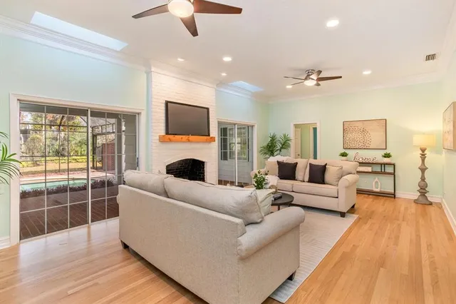 a living room with furniture fireplace and flat screen tv