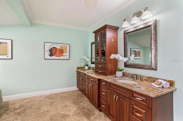 a spacious bathroom with a granite countertop sink mirror and double