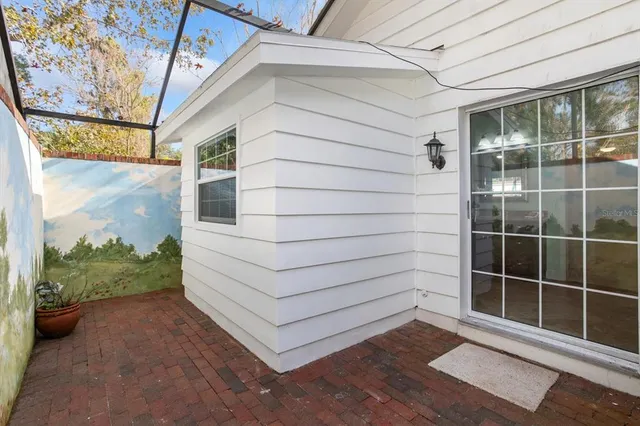 a view of kitchen with refrigerator and wooden floor