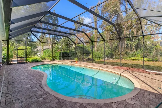 a view of a swimming pool with a patio