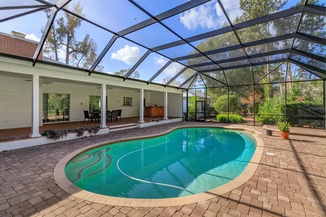 a view of a swimming pool with a patio