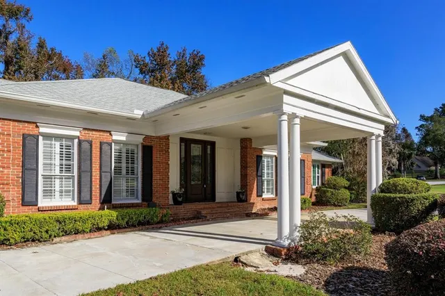 a view of a town with palm trees and a yard