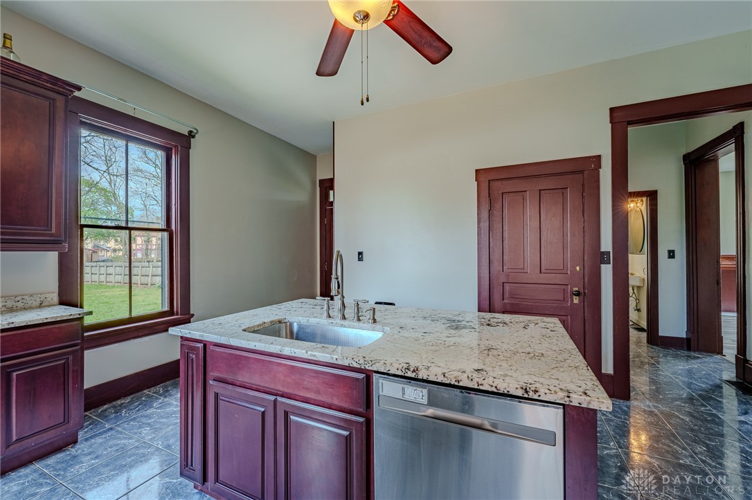 308 Yankee Road Middletown, OH 45044 - Photo 20 of 47 This bright kitchen boasts ample counter space, rich cabinetry, and a clear view of the outdoors.