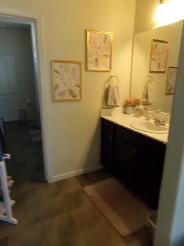 a view of an empty room with floor to ceiling window