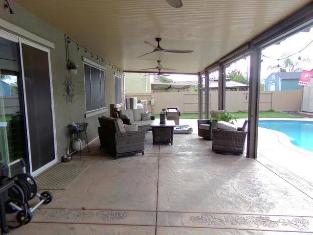 a view of a house with backyard and porch