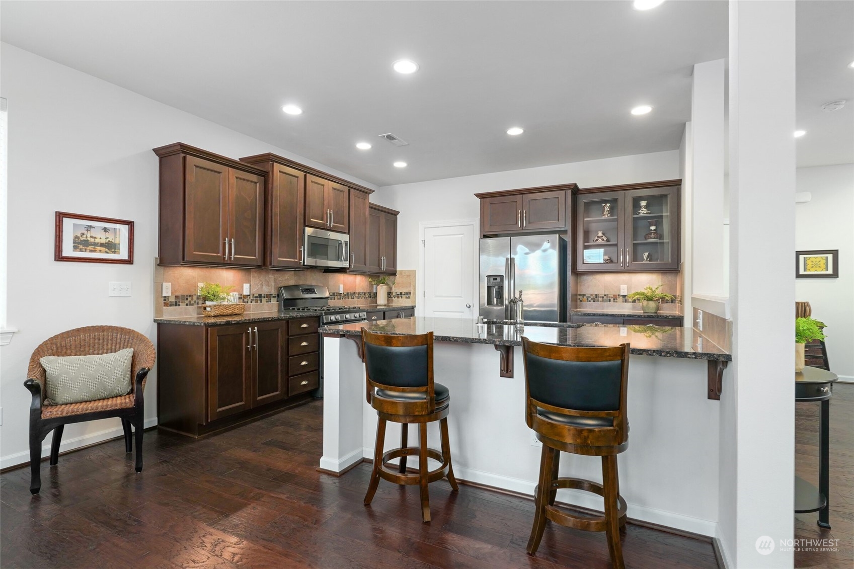 3533 198th Street Southeast Bothell, WA 98012 - Photo 11 of 27 a kitchen with a refrigerator and a dining table