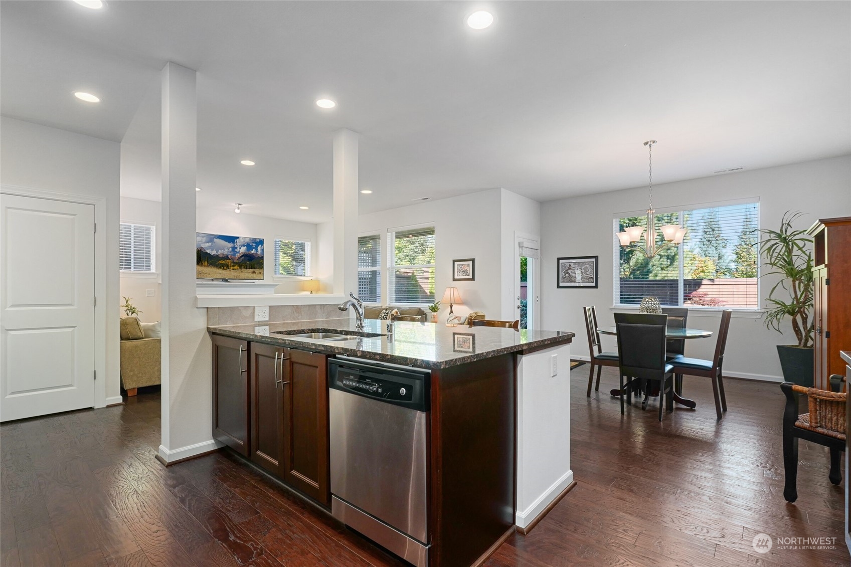 3533 198th Street Southeast Bothell, WA 98012 - Photo 13 of 27 a kitchen with stainless steel appliances granite countertop a stove and chairs