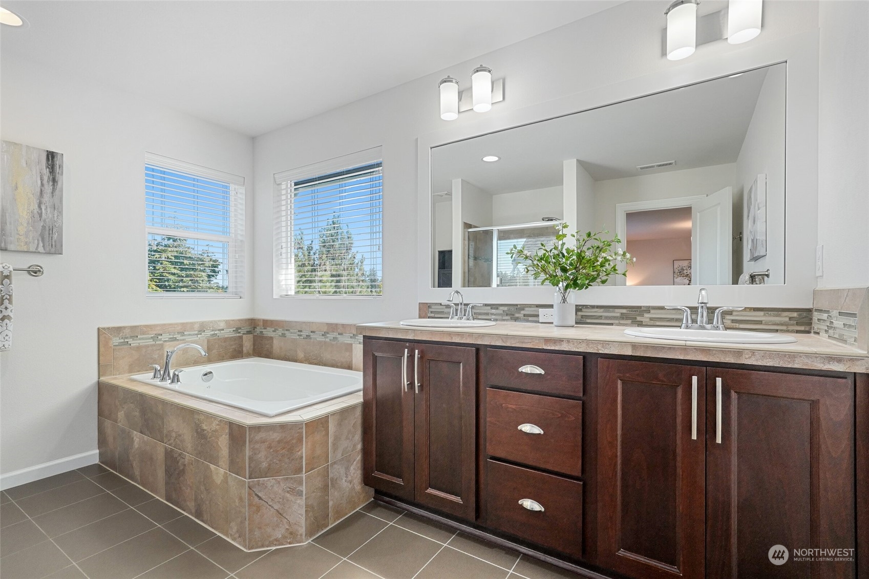 3533 198th Street Southeast Bothell, WA 98012 - Photo 16 of 27 a bathroom with a tub a sink and mirror