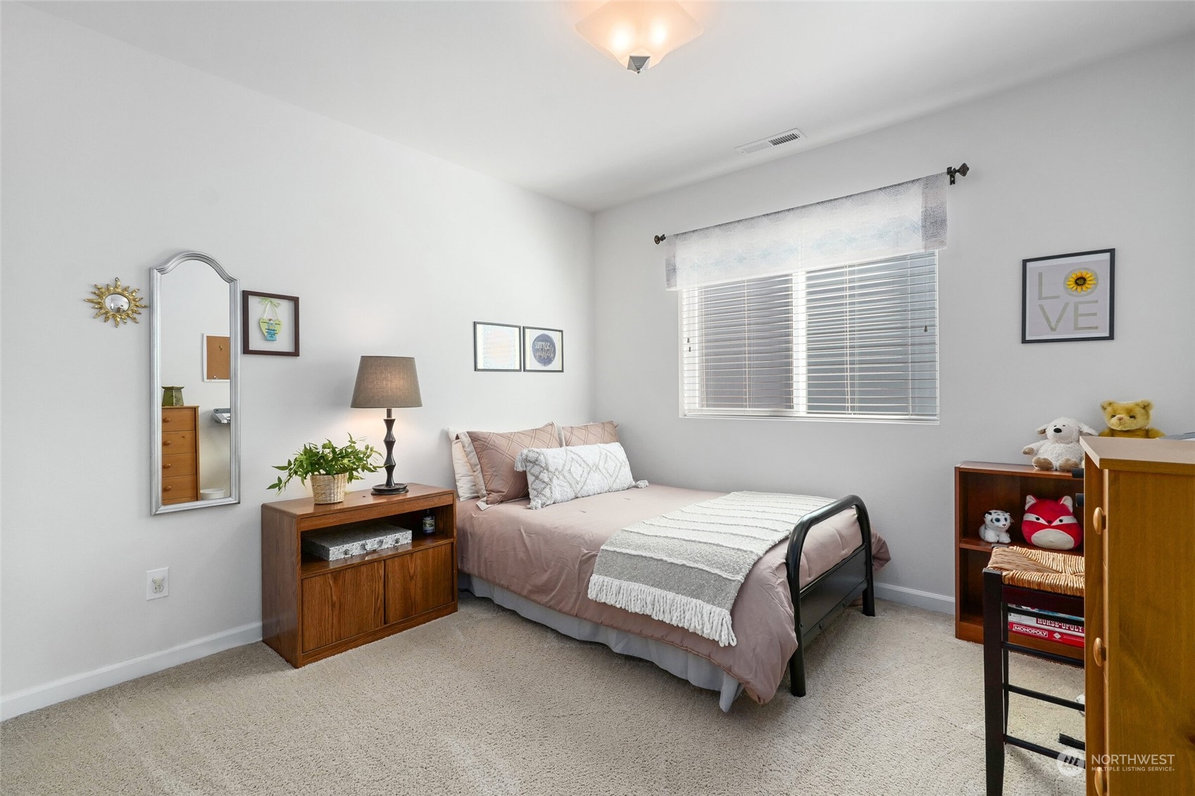 3533 198th Street Southeast Bothell, WA 98012 - Photo 18 of 27 a bedroom with a bed furniture and a window