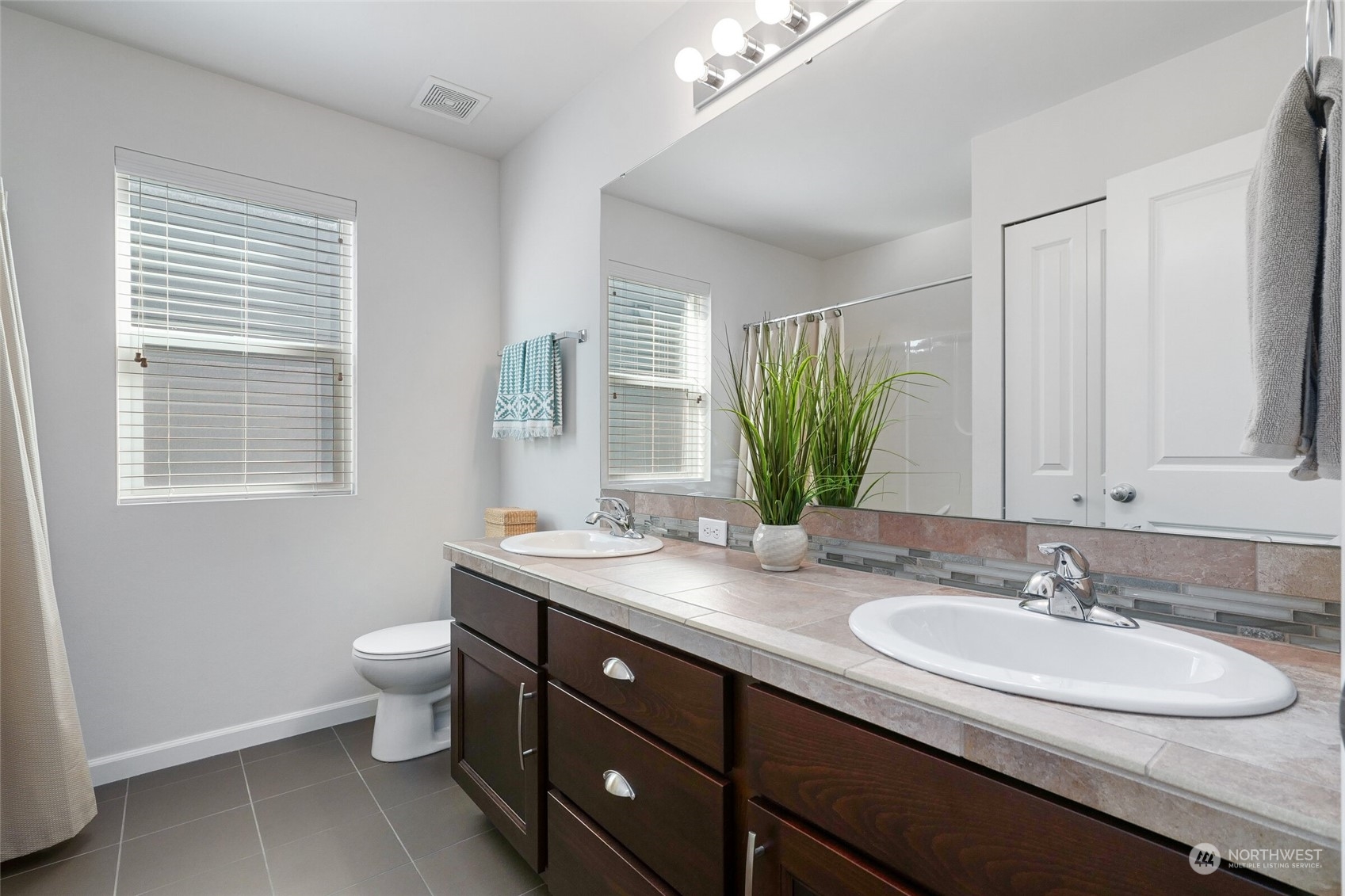 3533 198th Street Southeast Bothell, WA 98012 - Photo 20 of 27 a bathroom with a granite countertop sink and a mirror