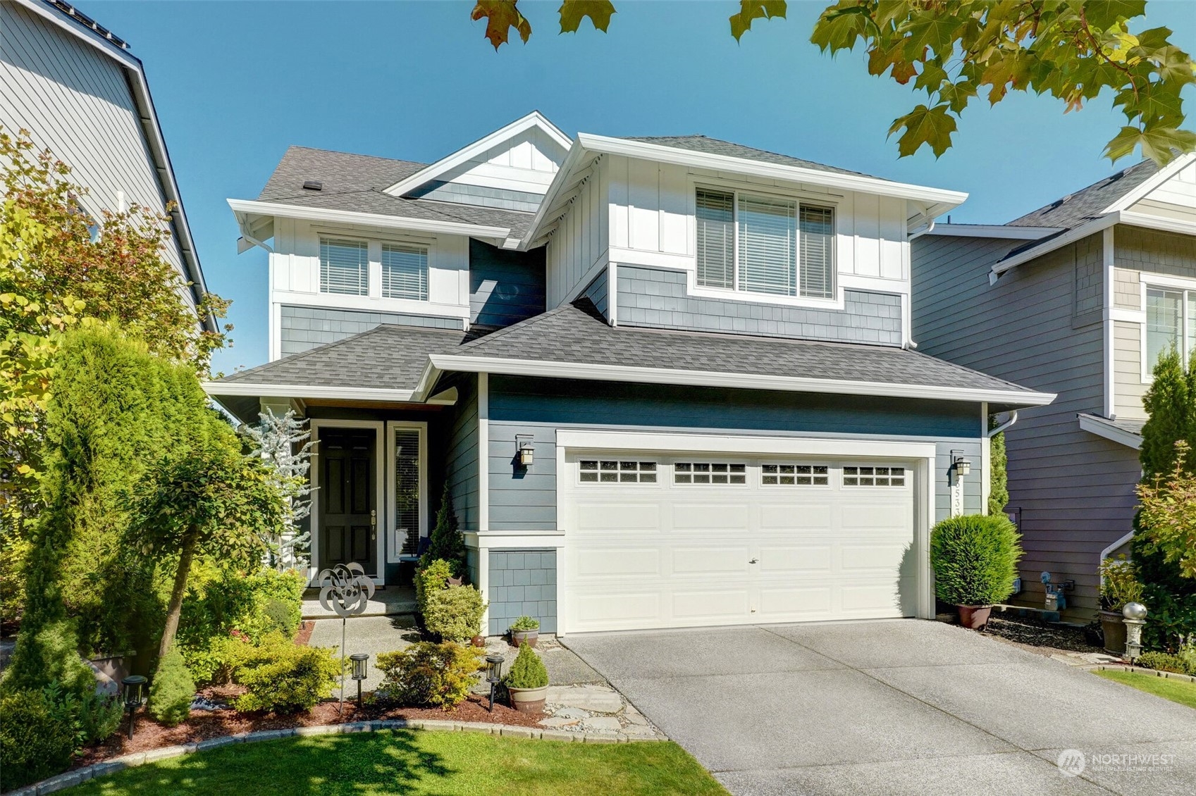 3533 198th Street Southeast Bothell, WA 98012 - Photo 2 of 27 a front view of a house with a yard garage and outdoor seating