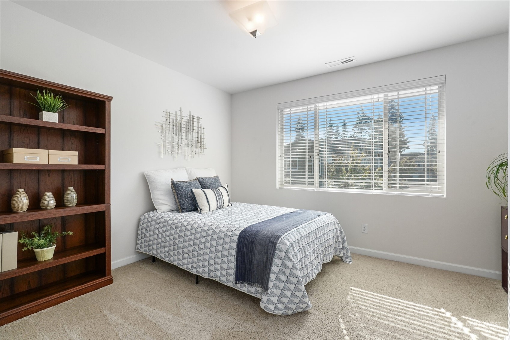 3533 198th Street Southeast Bothell, WA 98012 - Photo 22 of 27 a bedroom with a bed a table and a large window