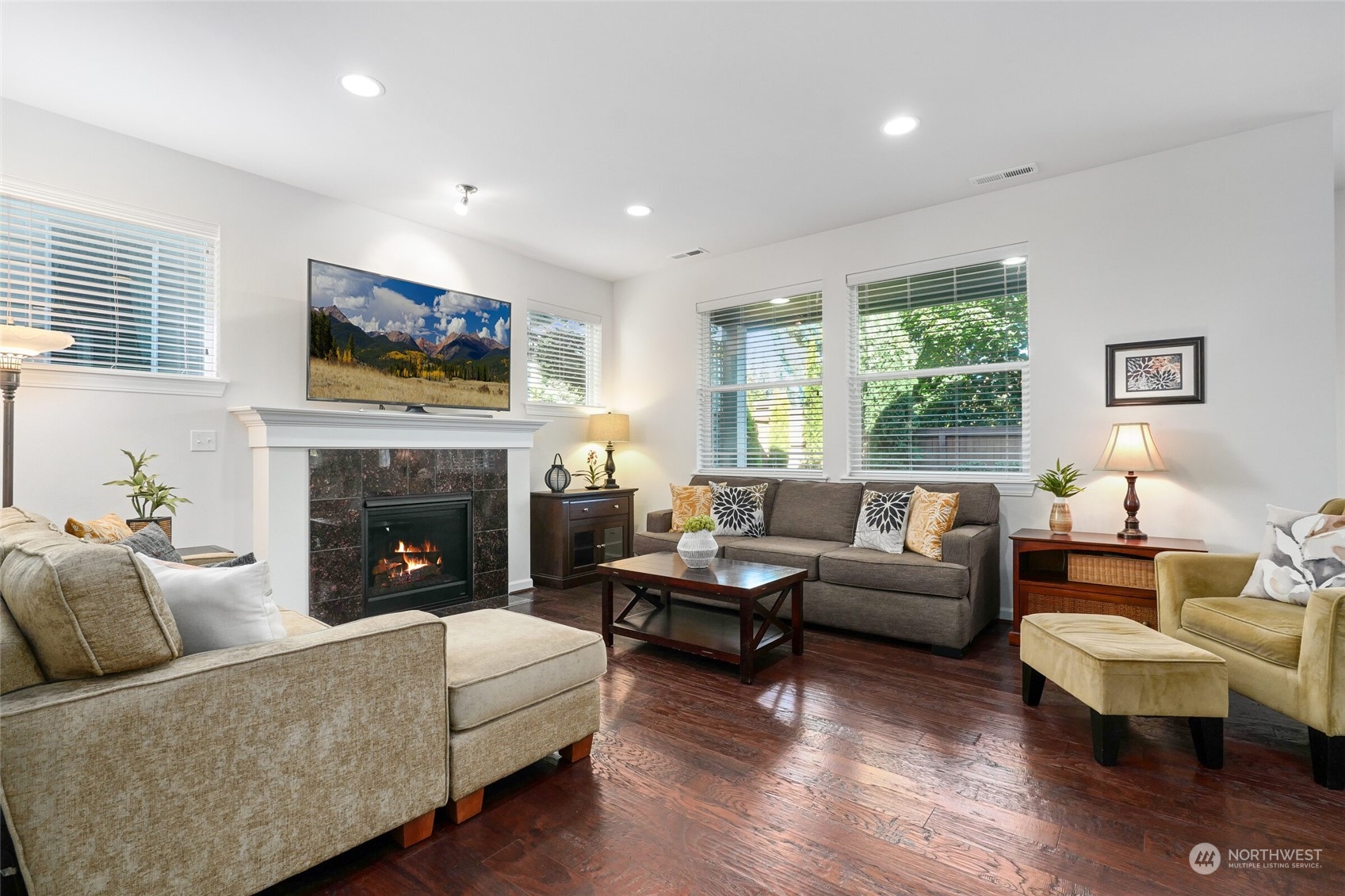 3533 198th Street Southeast Bothell, WA 98012 - Photo 7 of 27 a living room with furniture a flat screen tv and a fireplace
