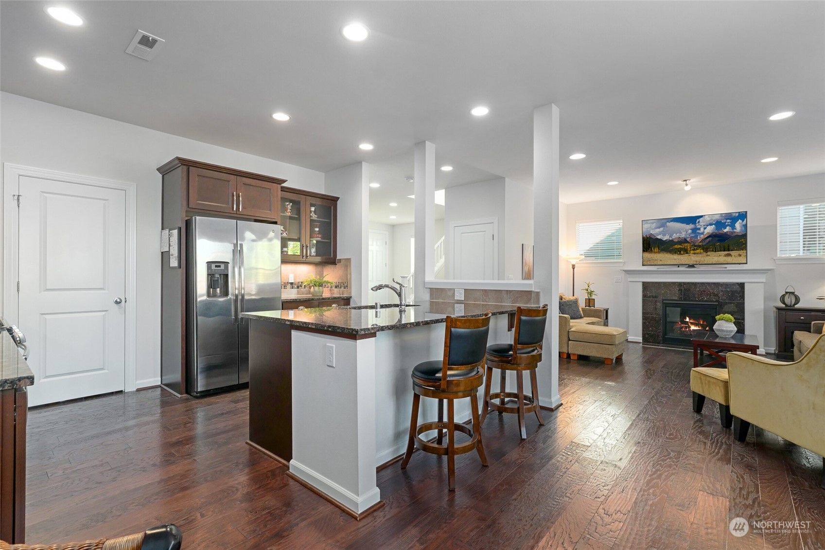 3533 198th Street Southeast Bothell, WA 98012 - Photo 10 of 27 a kitchen with a table chairs refrigerator and cabinets