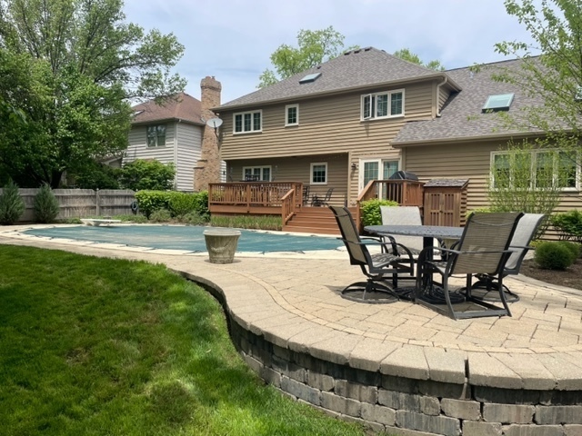 912 West Bailey Road Naperville, IL 60565 - Photo 2 of 16 a view of a house with backyard porch and sitting area