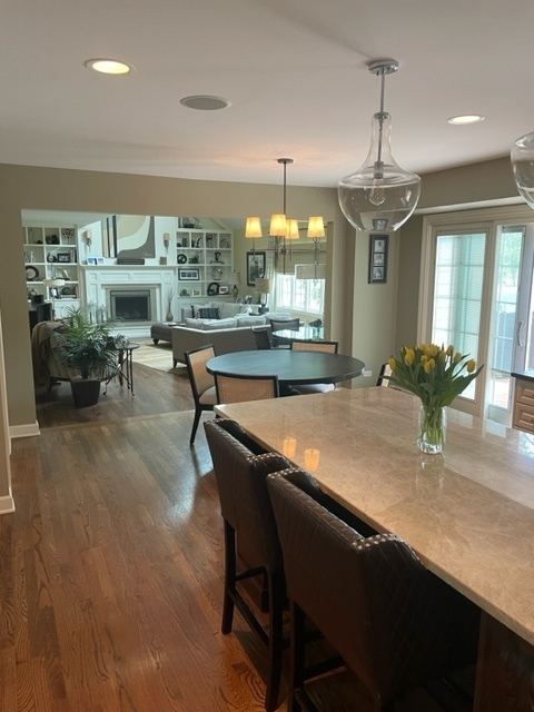912 West Bailey Road Naperville, IL 60565 - Photo 4 of 16 a dining room with a table chairs and chandelier