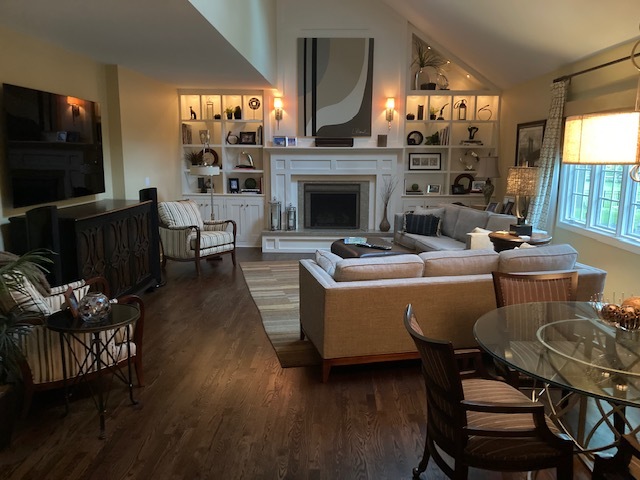 912 West Bailey Road Naperville, IL 60565 - Photo 7 of 16 a living room with furniture a flat screen tv and a fireplace