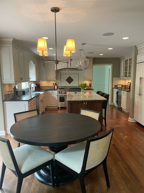 912 West Bailey Road Naperville, IL 60565 - Photo 9 of 16 a kitchen with a table chairs and microwave