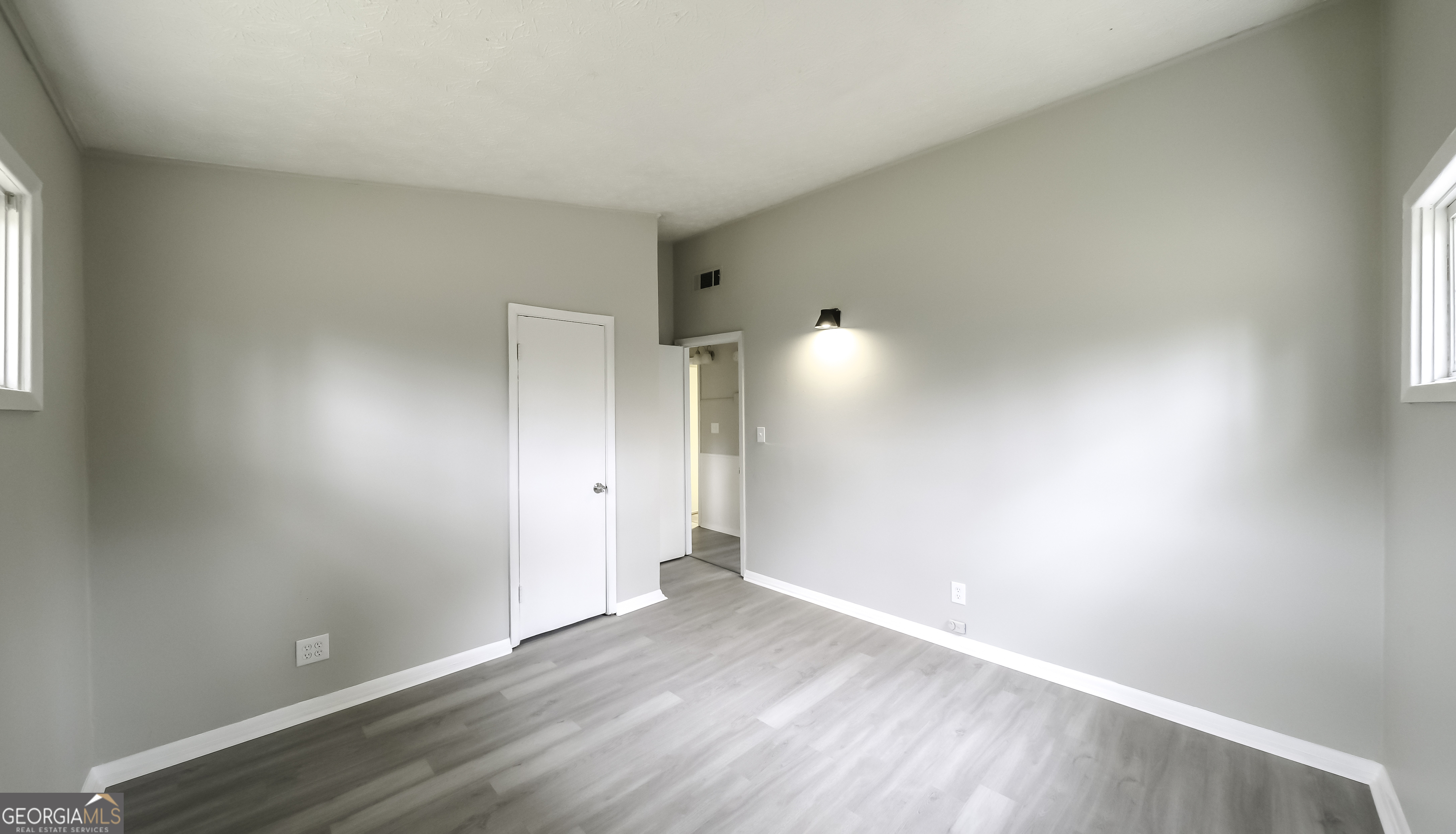 208 Richards Street Carrollton, GA 30117 - Photo 12 of 42 a view of an empty room and wooden floor