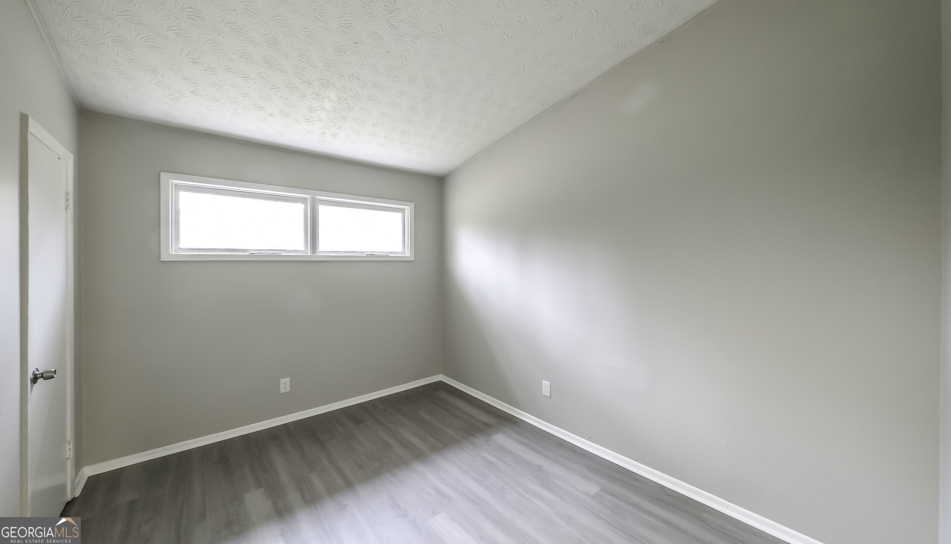 208 Richards Street Carrollton, GA 30117 - Photo 21 of 42 an empty room with a window