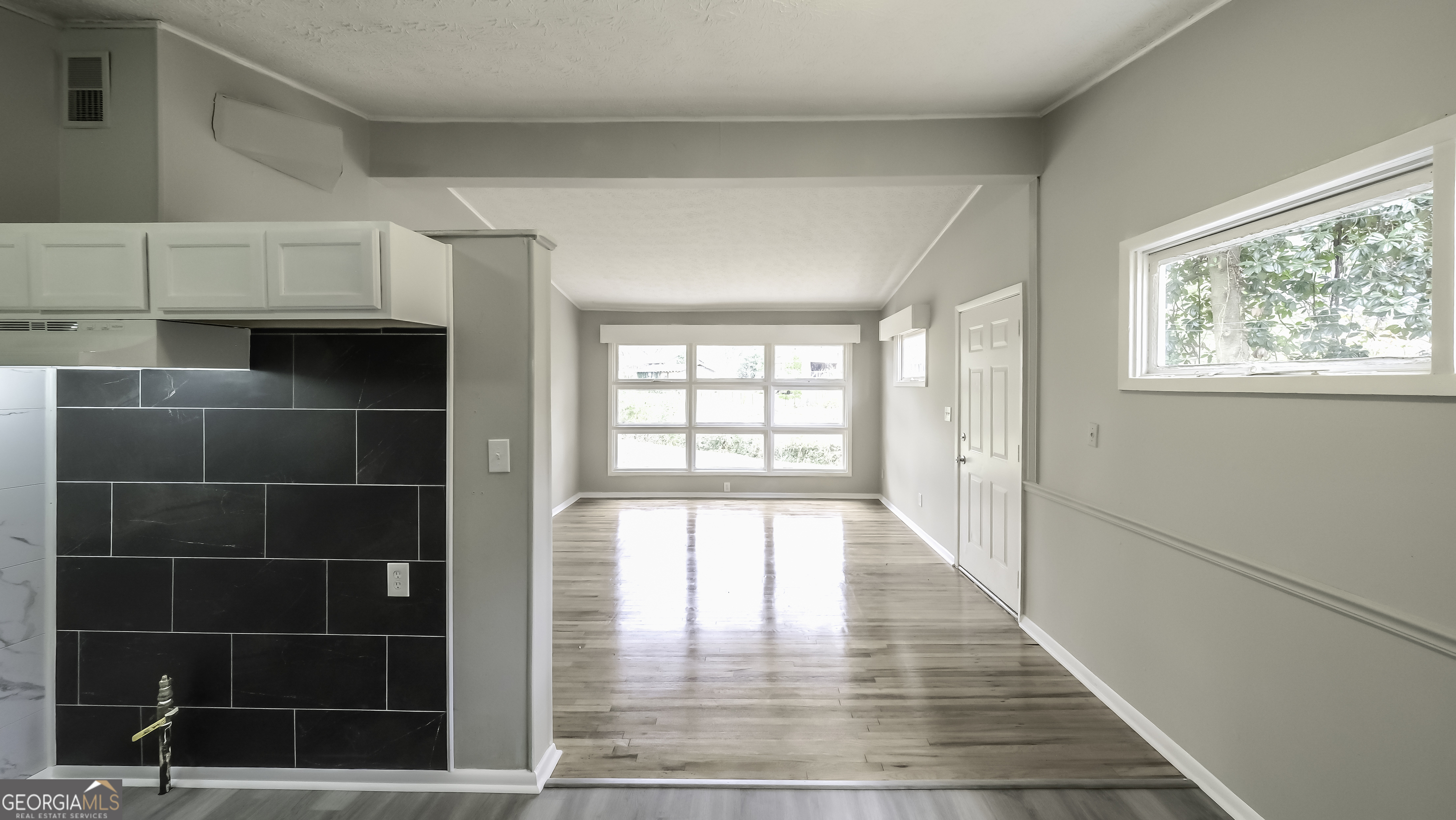 208 Richards Street Carrollton, GA 30117 - Photo 28 of 42 a view of an empty room with a window