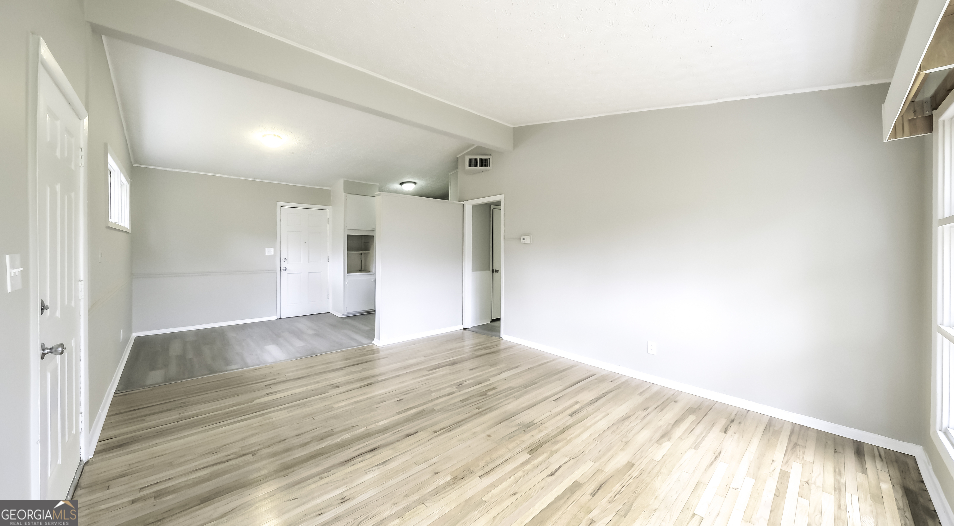 208 Richards Street Carrollton, GA 30117 - Photo 36 of 42 a view of empty room with wooden floor