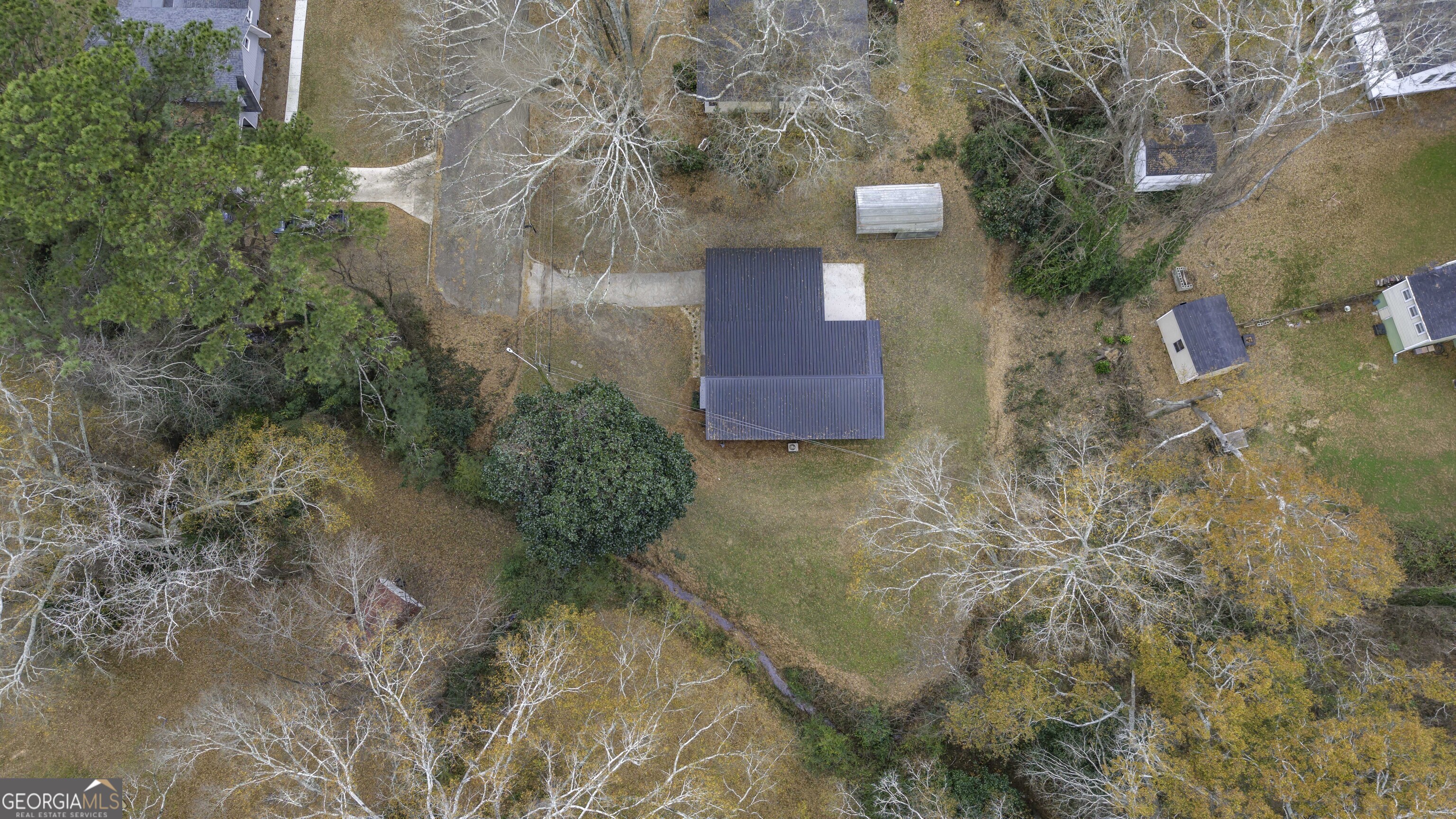 208 Richards Street Carrollton, GA 30117 - Photo 39 of 42 a view of a house with a yard