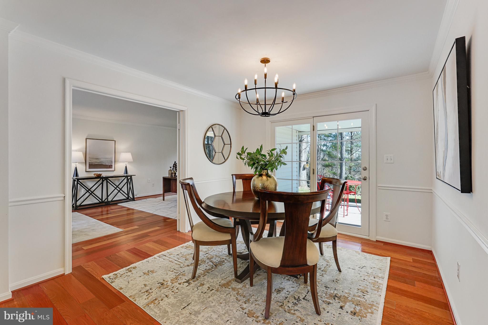 1807 Post Oak Trail Reston, VA 20191 - Photo 23 of 79 a view of a dining room with furniture window and wooden floor