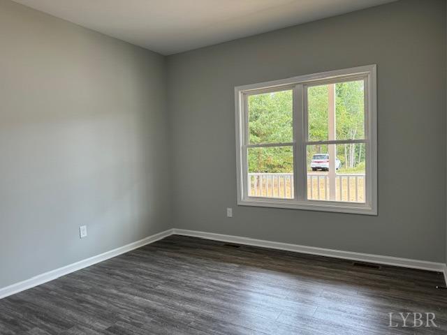 2351 Spg Grv Road Spout Spring, VA 24593 - Photo 12 of 28 a view of an empty room with wooden floor and a window