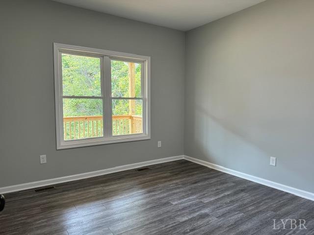 2351 Spg Grv Road Spout Spring, VA 24593 - Photo 13 of 28 a view of an empty room with wooden floor and a window