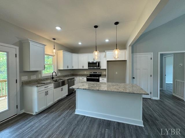 2351 Spg Grv Road Spout Spring, VA 24593 - Photo 5 of 28 a large kitchen with stainless steel appliances kitchen island a large counter top and wooden floors