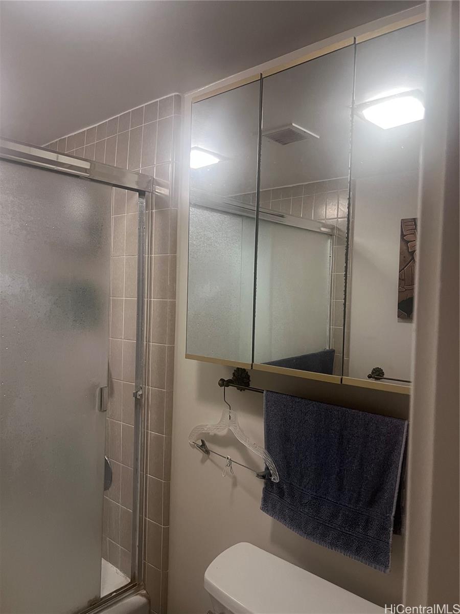 1650 Ala Moana Boulevard, Unit 3107 Honolulu, HI 96815 - Photo 11 of 22 a bathroom with a shower a toilet and a sink