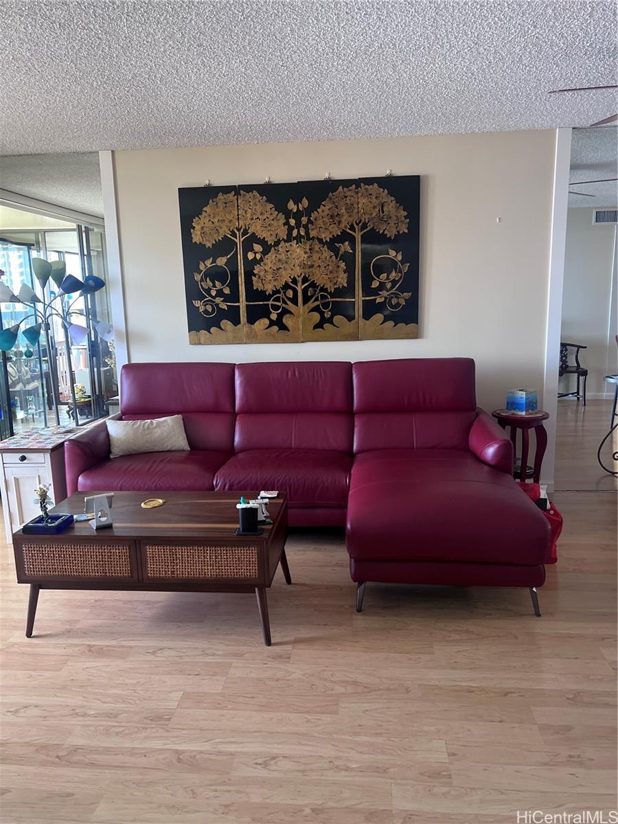 1650 Ala Moana Boulevard, Unit 3107 Honolulu, HI 96815 - Photo 16 of 22 a living room with furniture