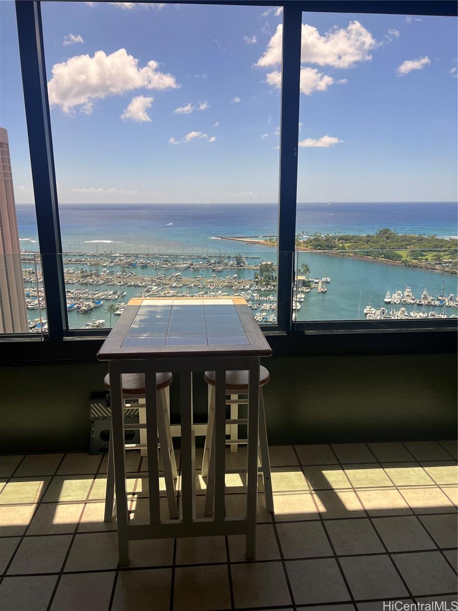 1650 Ala Moana Boulevard, Unit 3107 Honolulu, HI 96815 - Photo 21 of 22 a view of a balcony with an outdoor seating